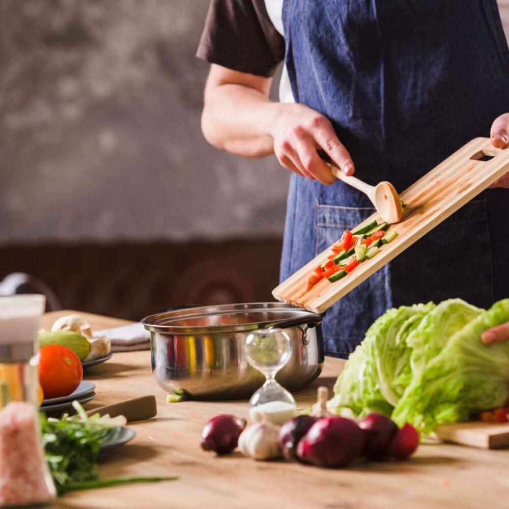 Couple cooking together in Kitchen