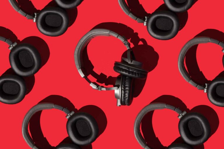 Many over head headphones laid on red floor rotated