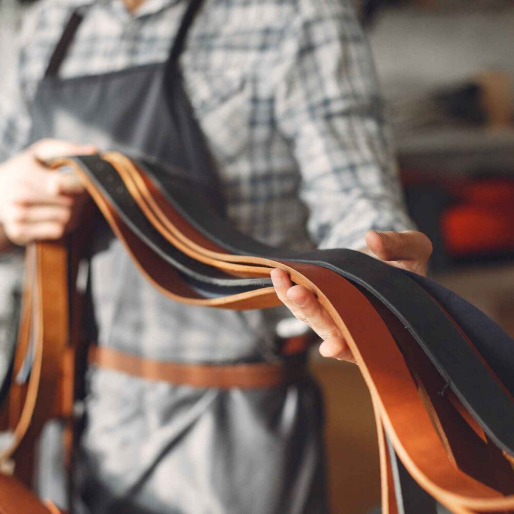 belt make holding brown belts black belts in hand