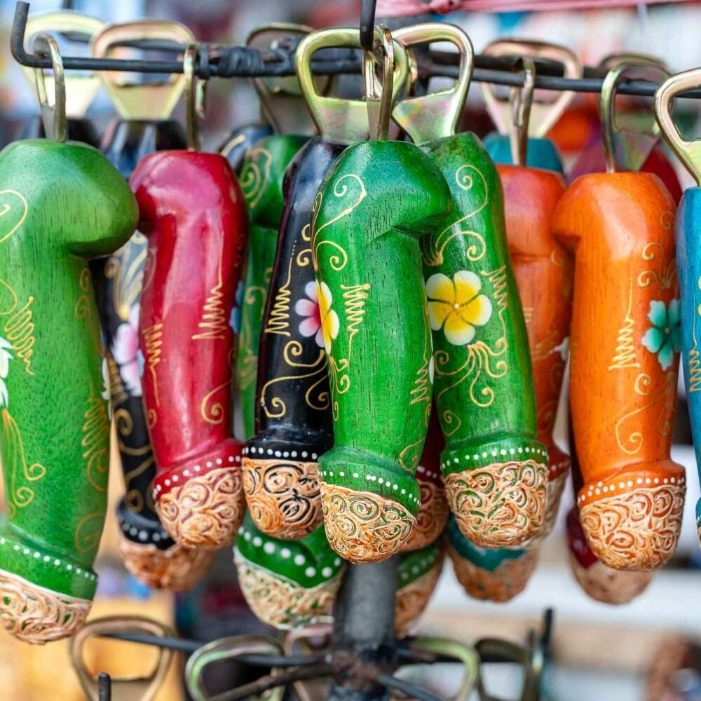 wooden penis bottle opener souvenirs displayed for sale