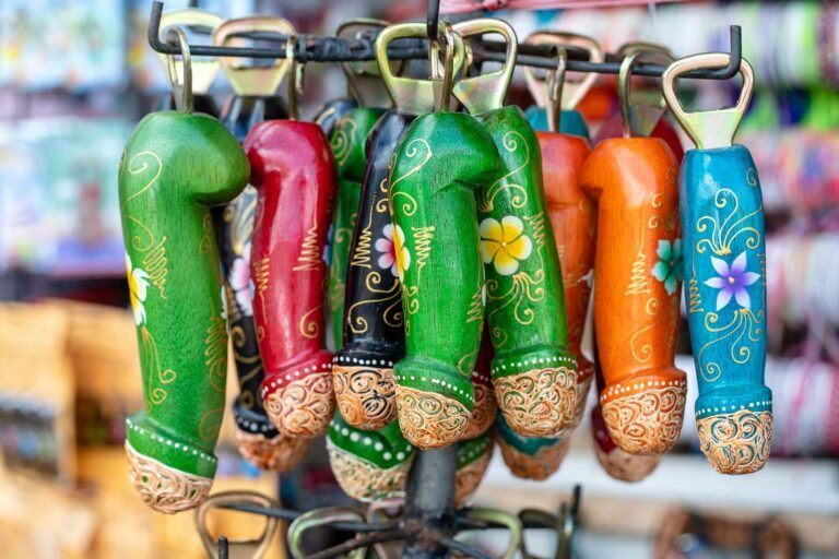 wooden penis bottle opener souvenirs displayed for sale