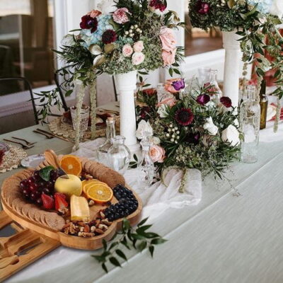 Apple shape charcuterie board charcuterie platter serving board organized with cheese items in a wedding party