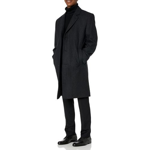 men wearing long topcoat and turtle neck tshirt black pant with formal shoe