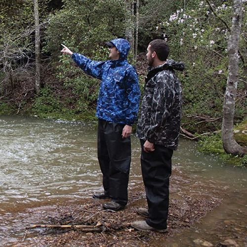 two men sightseeing the forest in the small lake wearing blue hooded raincoat and black raincoat