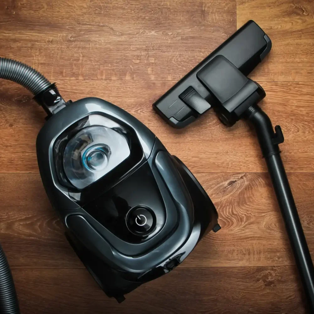 vacuum cleaner lying on the wooden floor