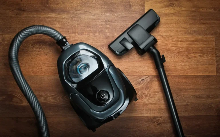 vacuum cleaner lying on the wooden floor