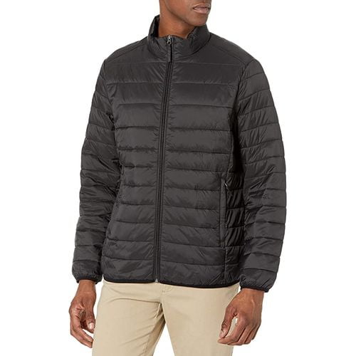 young man wearing cream color pant and the black puffer jacket young man wearing cream color pant and the black puffer jacket