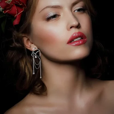 A Woman with red lipstick and red color artificial flower for hai wearing Abstract Woman Face Stone Earring 13