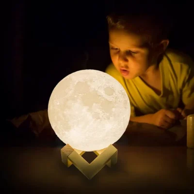 A boy looking at moon night light