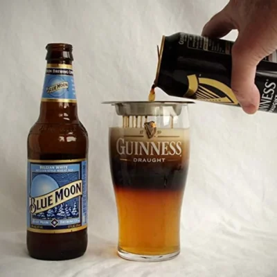 A man pouring beer using Beer Layering Tool