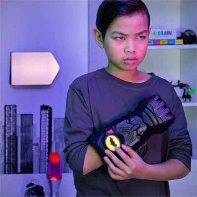 Kid wearing a batman Gauntlet 5