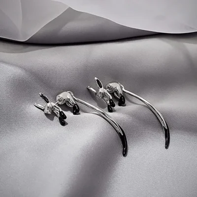 Sterling Sliver Fox Earring kept in a gray cloth for photoshoot 10