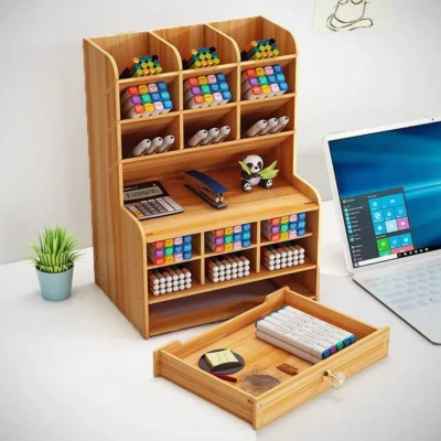 Office stationeris are organized in the wooden stationery desk organizer AC